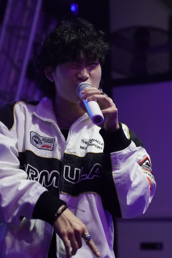 Sam Suen performing with microphone